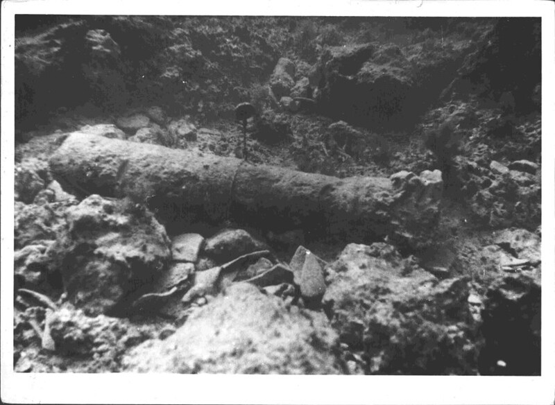 A black and white photograph of a damaged column that was excavated from the sea floor