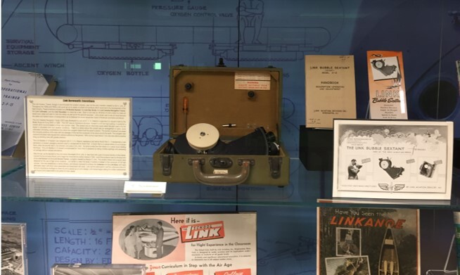 A photograph of the Link Bubble Sextant on display in the physical exhibit at Binghamton University Libraries