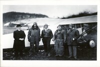 A black and white photograph of five men standing in front of an airplane after a delivery run