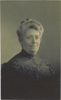 An old sepia portrait photograph of a middle-aged woman