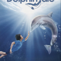 A boy floats next to a dolphin with a prosthetic tail, reaching out to her. Both figures are suspended in a clear blue 
ocean with beams of white sunlight stretching out from the center surface of the ocean. The title ""Dolphin Tale"" is 
centered in the top middle of the poster with an outline of a dolphin with a prosthetic tale composing the T of the title.
""Inspired by the amazing true story of winter"" is centered on the bottom of the poster.