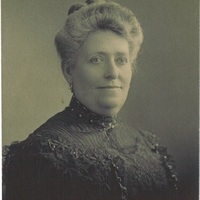 An old sepia portrait photograph of a middle-aged woman